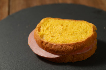 pumpkin flour sandwich with mortadella cooked on the plate