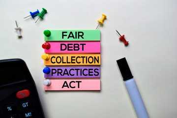 Fair Debt Collection Practices Act - FDCPA text on sticky notes isolated on office desk