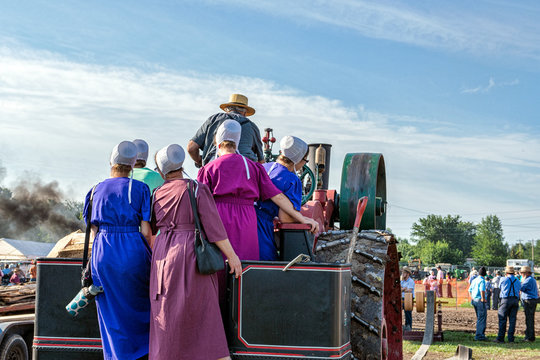 Amish Ladies Join Dad on Steam Engine