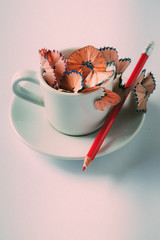 Back to school concept.A cup with shavings and pencils