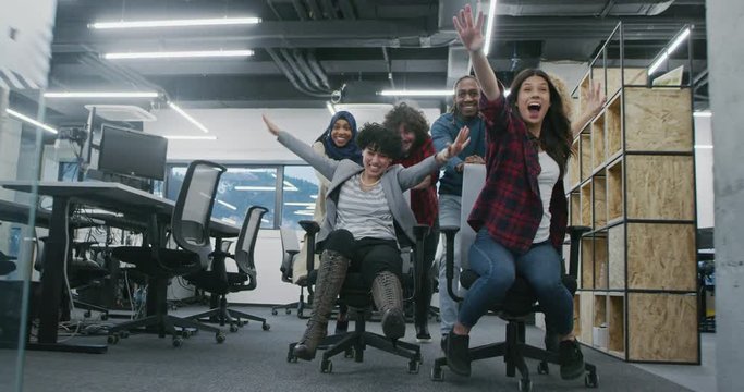 Young multiethnic business team of software developers working together using