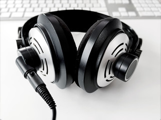 Obraz na płótnie Canvas professional headphone in black and white on a white table