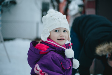 Young Girl Playing in Snow