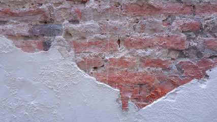 Cracked brick wall for background