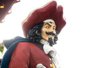  Mustached pirate figure in red hat and coat