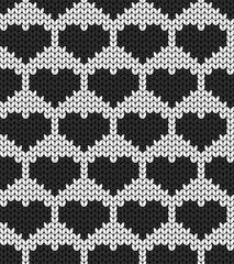Geometric hearts. Seamless decorative background. Jacquard weave. Knitted pattern.