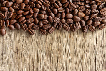Coffee beans on old wood background 