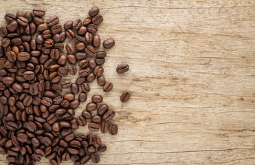 Coffee beans on old wood background 