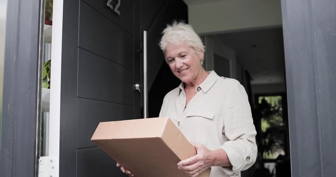 Mature female receiving home delivery