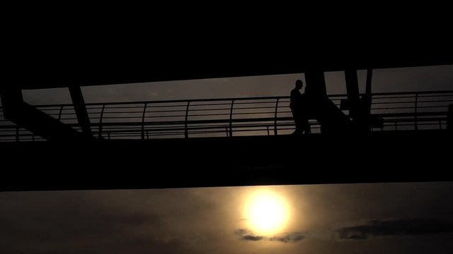 Silouettes at The Subway Bridge at the Istanbul Golden Horn in Slow Motion