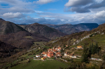 Fototapeta na wymiar Landscape with a little village on a sunny day 