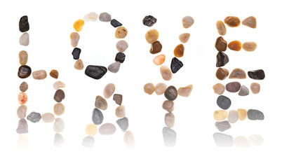 Words LOVE - HATE handmade with stones (boulders) diluted with each other. Collection words with stones. Isolated on white background