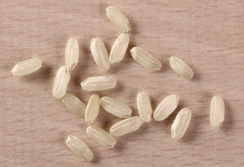 Macro integral rice pile on board background and texture, top view
