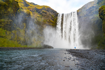 Visitor at Skogafoss Waterfall in Iceland