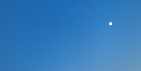 Clear blue sky with moon, beautiful background