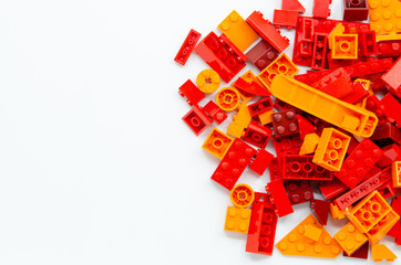 Red and Orange Educational Toys Bricks Blocks Top View isolated on White Background
