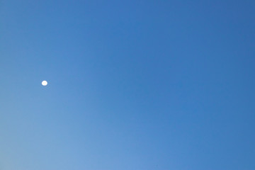 Clear blue sky with moon, beautiful background