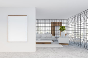 Office waiting room with white sofas and poster