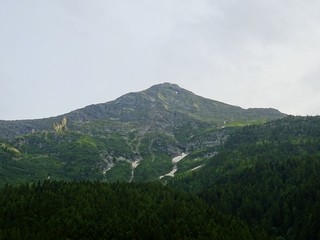 The Alps with its woods and glaciers near Monte Rosa and the town of Macugnaga, Italy - July 2019.