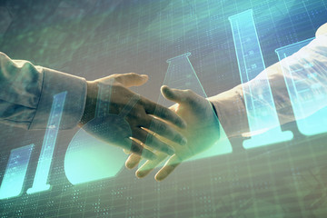 Multi exposure of lab flasks hologram on abstract background with two men handshake. Concept of...