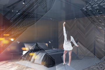 Woman in black bedroom interior