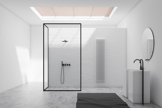 White bathroom interior with shower and sink