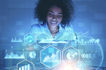 Smiling African woman working with infographics