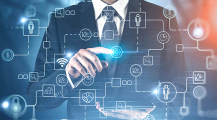 Businessman with tablet using internet interface