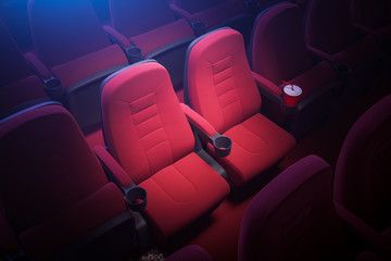 Top view of empty red cinema seats - obrazy, fototapety, plakaty