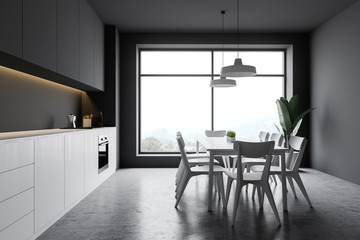 Gray kitchen with window and table