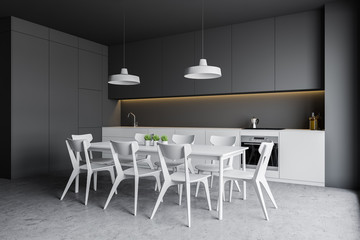 Gray kitchen corner with white counters and table