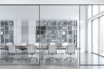 White conference room interior with glass doors