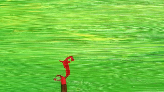 Painting hashtag love words with red color on mixed yellow and green color canvas. Acrylic on canvas.