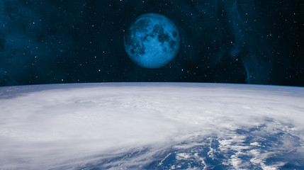 Fototapeta na wymiar Giant hurricane over the Earth seen from the space with moon