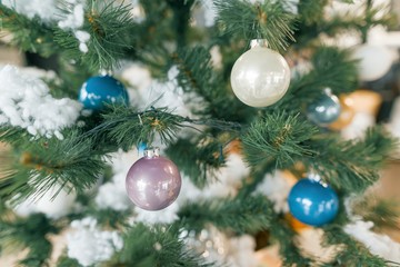 Background christmas tree decorated with toys balls