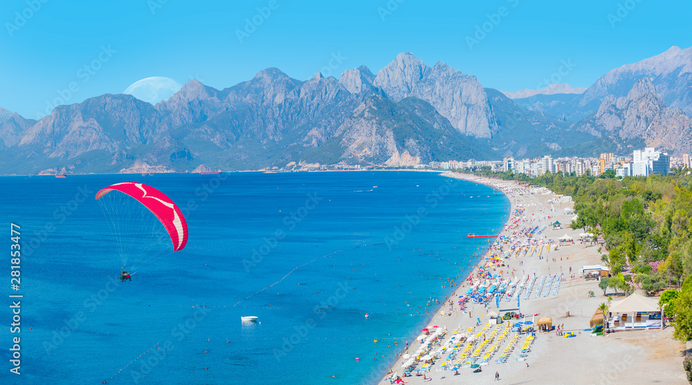 Wall mural Paraglider flies in the sky - Konyaalti Beach, Antalya Turkey