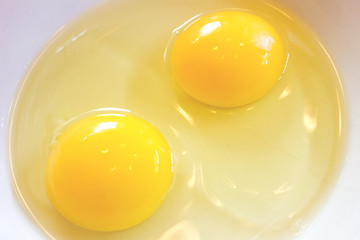 Close-Up Two Yolk On White Plate