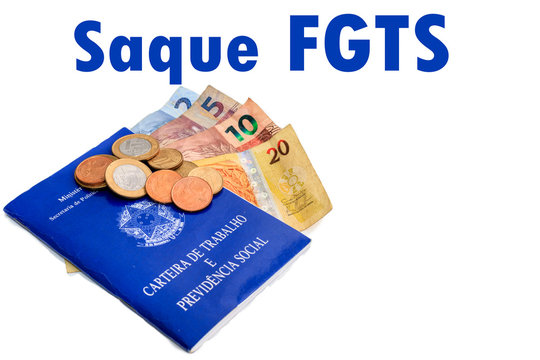 Portuguese text, withdrawal of fgts. in the background Brazilian working paper, coins and cedulas of real.