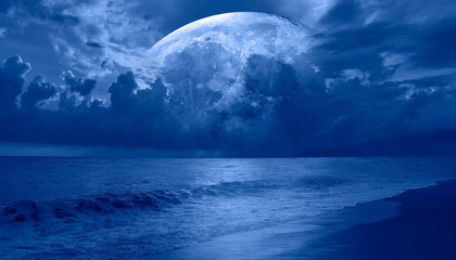 Fototapeta na wymiar Moon over the sea with lot of stars and nebula at night 