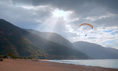Paraglider flies in the sky - Oludeniz Beach And Blue Lagoon, Fethiye