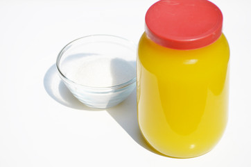 A jar of honey and sugar isolated on white,photo