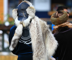 Kazakh in national clothes and a fur hat