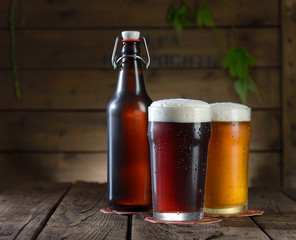 Beer. Beer bottle and glass on a wooden background
