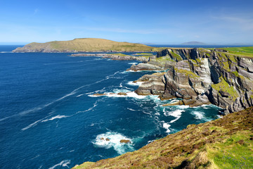 Amazing wave lashed Kerry Cliffs, the most spectacular cliffs in County Kerry, Ireland. Tourist attractions on famous Ring of Kerry route. © MNStudio