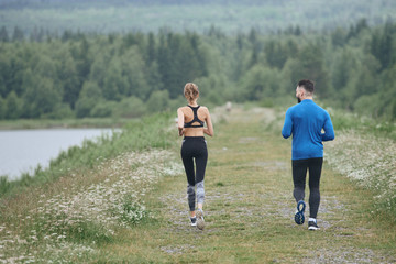 Man and woman running far away the wild road