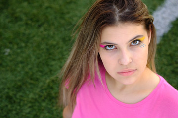 young girl with bright and creative make-up. close-up