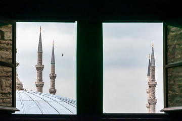 Islamic minaret towers viewed from window