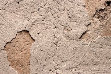 Old cob wall with cracked surface