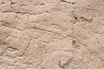 Old cob wall with cracked surface