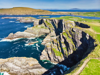 Amazing wave lashed Kerry Cliffs, the most spectacular cliffs in County Kerry, Ireland. Tourist...